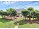 Serene backyard with a stone pathway, lush greenery, and a patio perfect for outdoor relaxation at 2289 Veery Ln, Rock Hill, SC 29732