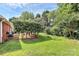 Lush backyard featuring manicured landscaping, a healthy lawn, and mature trees at 2289 Veery Ln, Rock Hill, SC 29732