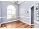 Bright dining room with hardwood floors, a large window, and stylish decor perfect for Gathering gatherings at 2289 Veery Ln, Rock Hill, SC 29732