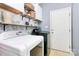 Functional laundry room with shelving, storage, washer, and dryer at 2289 Veery Ln, Rock Hill, SC 29732