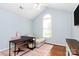Home office with a vaulted ceiling, an oversized window, and a modern desk at 2289 Veery Ln, Rock Hill, SC 29732