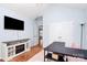 Inviting office with built-in fireplace, neutral walls, hardwood floors, and a large TV at 2289 Veery Ln, Rock Hill, SC 29732