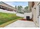 Fenced backyard with concrete patio and grassy area, offering privacy at 2635 Mccurdy Trl, Charlotte, NC 28269