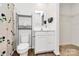 Cozy bathroom featuring a toilet, a vanity, and linen shelves at 2635 Mccurdy Trl, Charlotte, NC 28269