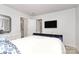 Comfortable bedroom with TV, white dresser, and ensuite bathroom offering modern living at 2635 Mccurdy Trl, Charlotte, NC 28269