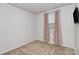 Bright bedroom features a window with pink curtains and neutral carpet at 2635 Mccurdy Trl, Charlotte, NC 28269