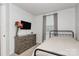 Cozy bedroom featuring a decorative accent wall, a TV, and a dresser at 2635 Mccurdy Trl, Charlotte, NC 28269