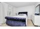 Bright bedroom featuring a plush velvet bedframe, ample natural light, and modern decor at 2635 Mccurdy Trl, Charlotte, NC 28269
