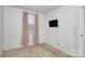 Neutral bedroom features a TV, a window with curtains, and neutral carpet at 2635 Mccurdy Trl, Charlotte, NC 28269