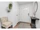 Inviting foyer with a chair, mirror, and stylish decor elements at 2635 Mccurdy Trl, Charlotte, NC 28269