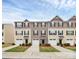 A row of well-maintained townhouses with consistent landscaping and attached garages at 2635 Mccurdy Trl, Charlotte, NC 28269