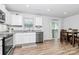 Bright and modern kitchen features stainless steel appliances and dining area at 2635 Mccurdy Trl, Charlotte, NC 28269