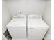 Convenient laundry room equipped with modern, white washer and dryer appliances at 2635 Mccurdy Trl, Charlotte, NC 28269