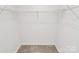 Spacious walk-in closet featuring a neutral color and organized shelving at 2635 Mccurdy Trl, Charlotte, NC 28269