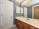 Bathroom featuring a vanity with drawers and a large mirror with lights at 2919 Peachwood Ct, Fort Mill, SC 29715