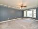 Spacious bedroom with carpet, patterned wallpaper, and bay windows at 2919 Peachwood Ct, Fort Mill, SC 29715