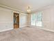 Well-lit dining area with large window, neutral carpet and chandelier at 2919 Peachwood Ct, Fort Mill, SC 29715