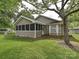 Charming home with a screened-in porch, surrounded by lush greenery at 2919 Peachwood Ct, Fort Mill, SC 29715