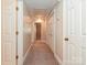 Hallway with multiple doors and neutral carpet at 2919 Peachwood Ct, Fort Mill, SC 29715