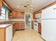 Charming kitchen with wooden cabinets, and a view into the living area at 2919 Peachwood Ct, Fort Mill, SC 29715