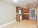 Kitchen showcasing wooden cabinetry, flooring, and countertop space at 2919 Peachwood Ct, Fort Mill, SC 29715