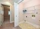 Functional laundry room with tile flooring, wire shelving, and hookups at 2919 Peachwood Ct, Fort Mill, SC 29715