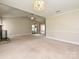 Vast living room area featuring vaulted ceilings, fireplace and an open entryway at 2919 Peachwood Ct, Fort Mill, SC 29715