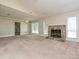 Large living room featuring vaulted ceilings, stone fireplace, and large windows at 2919 Peachwood Ct, Fort Mill, SC 29715