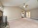 Spacious living room featuring stone fireplace, neutral carpet, vaulted ceiling and open floor plan at 2919 Peachwood Ct, Fort Mill, SC 29715