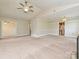 Open-concept living room with vaulted ceiling and access to kitchen and other rooms at 2919 Peachwood Ct, Fort Mill, SC 29715