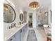 Elegant bathroom featuring dual vanities, a glass-enclosed shower, and a soaking tub with modern fixtures at 2954 Holbrook Rd, Fort Mill, SC 29715