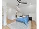 Bright bedroom with wood floors, blue bedding, an ensuite, and neutral walls at 2954 Holbrook Rd, Fort Mill, SC 29715