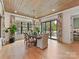 Bright dining room with wood ceiling, ample natural light, and backyard views through large windows at 2954 Holbrook Rd, Fort Mill, SC 29715