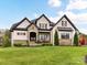 Beautiful home showcasing a manicured front lawn and stone accents on the facade at 2954 Holbrook Rd, Fort Mill, SC 29715
