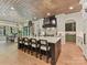 Spacious gourmet kitchen boasts a large center island with seating and a dining area with backyard views at 2954 Holbrook Rd, Fort Mill, SC 29715