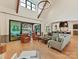 Spacious living room featuring high ceilings, hardwood floors, and an open layout to the kitchen at 2954 Holbrook Rd, Fort Mill, SC 29715