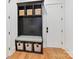 This mudroom features a black storage unit with baskets and a cushioned bench at 2954 Holbrook Rd, Fort Mill, SC 29715