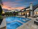 Large backyard pool and patio with outdoor seating, and a beautiful sunset sky at 2954 Holbrook Rd, Fort Mill, SC 29715