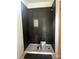 Modern bathroom with a black tile shower and a built in niche for toiletries at 3137 Riber Ln, Claremont, NC 28610