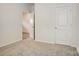 Bedroom featuring plush carpeting, natural light from windows, and closet access at 3662 Charles Nw St, Conover, NC 28613