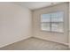 This cozy bedroom features neutral carpeting and a window providing natural light at 3662 Charles Nw St, Conover, NC 28613