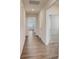 Bright hallway with wood floors leading to various rooms, showcasing the home's open layout at 3662 Charles Nw St, Conover, NC 28613