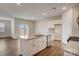 Modern kitchen features a central island, granite countertops, stainless steel appliances, and white cabinetry at 3662 Charles Nw St, Conover, NC 28613