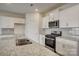 Kitchen featuring granite countertops, stainless steel appliances, white cabinets and an island with a sink at 3662 Charles Nw St, Conover, NC 28613
