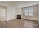 Bright living room showcases a cozy fireplace, neutral walls and hard surface flooring at 3662 Charles Nw St, Conover, NC 28613