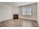Bright living room showcases a cozy fireplace, neutral walls and hard surface flooring at 3662 Charles Nw St, Conover, NC 28613