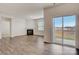 Open-concept living room features a fireplace, sliding glass doors and hard surface flooring at 3662 Charles Nw St, Conover, NC 28613