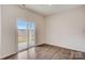 Bright living area features a sliding glass door to the backyard and hard surface flooring at 3662 Charles Nw St, Conover, NC 28613