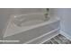Bright bathroom featuring corner bathtub at 3905 Coleman Dr, Charlotte, NC 28215