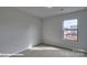 Neutral bedroom with carpet, bright white walls, and a sunny window view at 3905 Coleman Dr, Charlotte, NC 28215